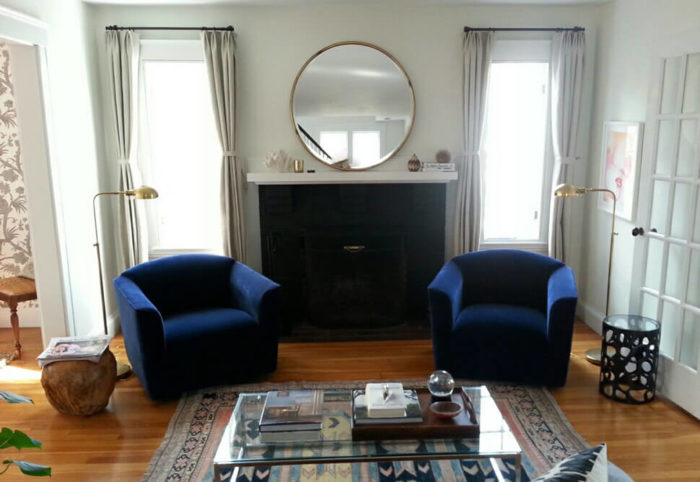 Two blue chairs sitting in a living room in Back Bay, Massachusetts