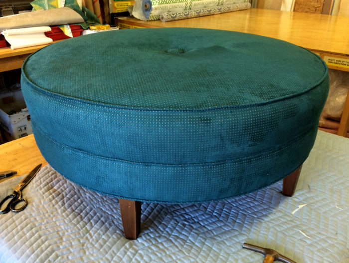 Turquoise ottoman with small spots